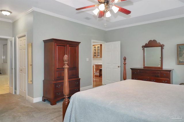 bedroom featuring crown molding, light colored carpet, and ceiling fan