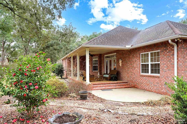 rear view of property featuring a patio area