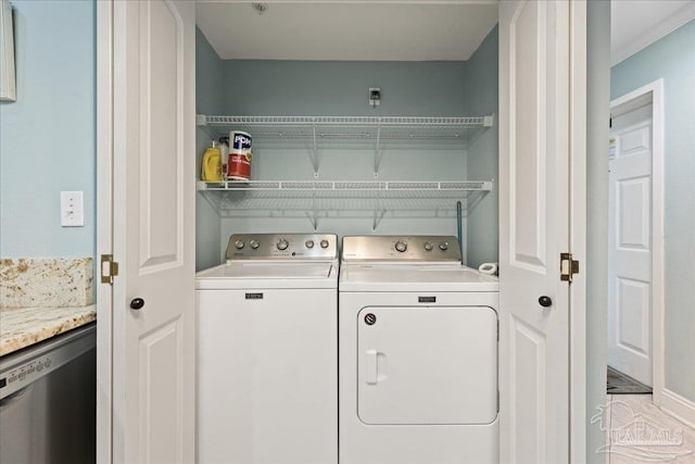 clothes washing area featuring washing machine and dryer