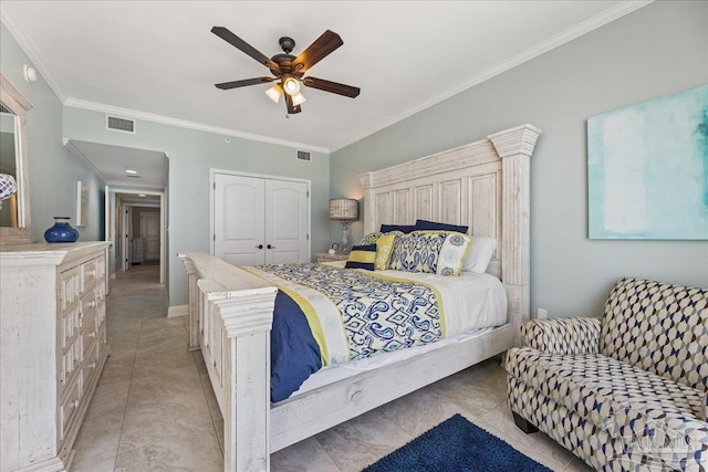 bedroom with ceiling fan, ornamental molding, a closet, and light tile patterned floors