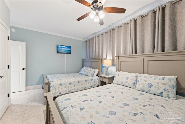 tiled bedroom featuring ornamental molding and ceiling fan