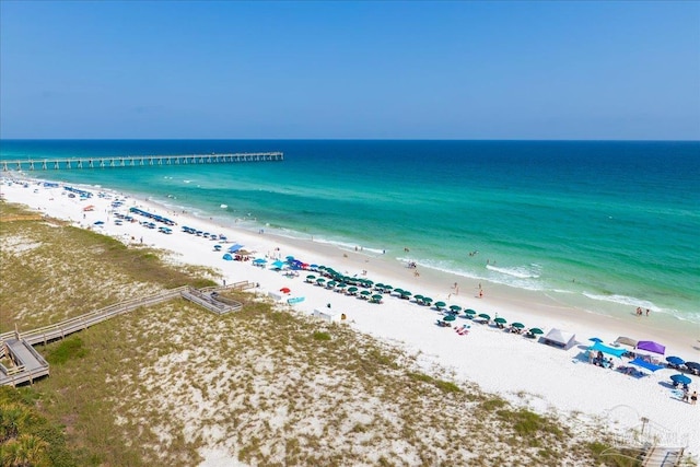 birds eye view of property with a beach view and a water view