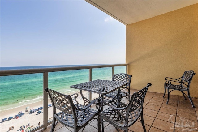 balcony with a beach view and a water view