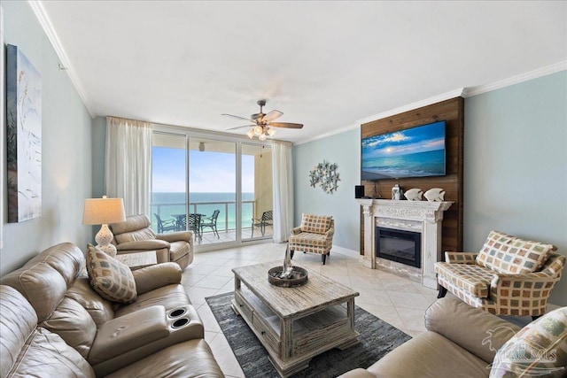 tiled living room with crown molding, a wall of windows, and ceiling fan