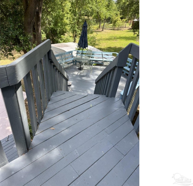 wooden deck with a yard