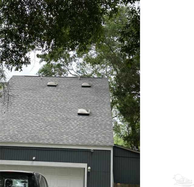 view of property exterior with a garage