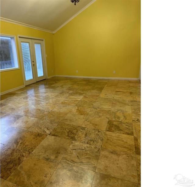 empty room with french doors, lofted ceiling, and ornamental molding