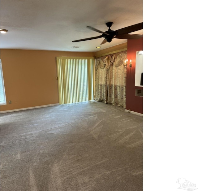 unfurnished room with carpet floors and ceiling fan