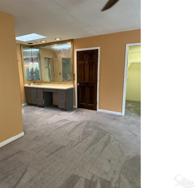 bathroom with vanity and ceiling fan