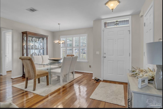 1707 Cedrus Ln, Pensacola, FL 32514 - dining space featuring wood finished floors and a chandelier