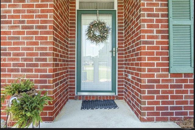 1707 Cedrus Ln, Pensacola, FL 32514 - view of exterior entry featuring brick siding