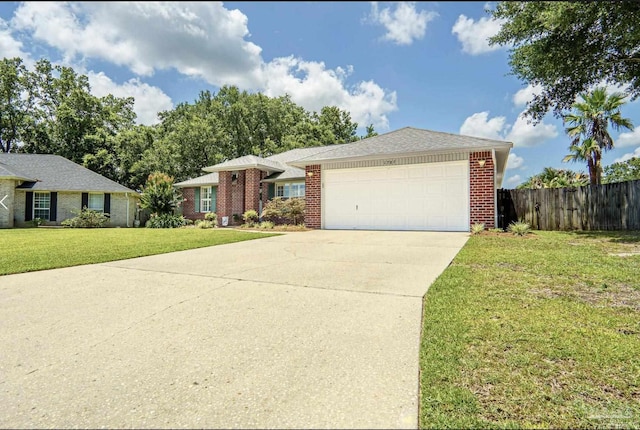 1707 Cedrus Ln, Pensacola, FL 32514 - ranch-style house featuring a garage, driveway, and brick siding