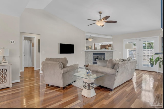 1707 Cedrus Ln, Pensacola, FL 32514 - living room with lofted ceiling, ceiling fan, wood finished floors, french doors, and a tiled fireplace