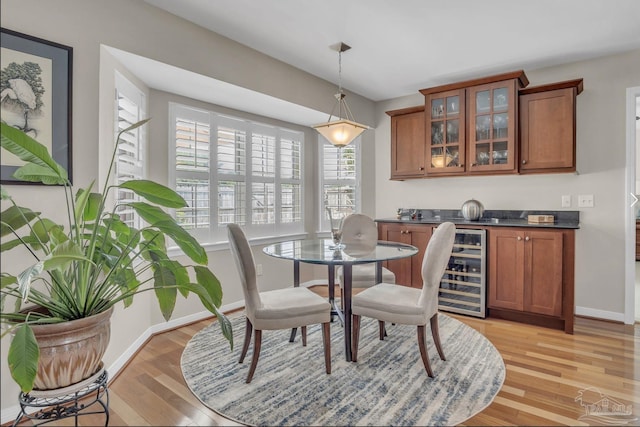 1707 Cedrus Ln, Pensacola, FL 32514 - dining room featuring beverage cooler and light wood-type flooring