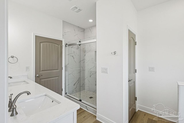 605 Ard Field Rd, Jay, FL 32565 - full bath with a marble finish shower, wood finished floors, double vanity, and recessed lighting