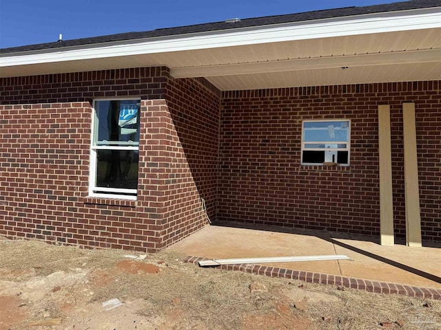 view of property exterior featuring brick siding