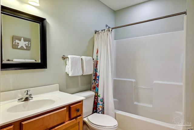 full bathroom with vanity, toilet, and shower / tub combo with curtain