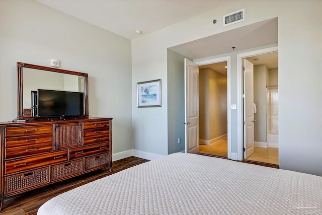 bedroom with connected bathroom