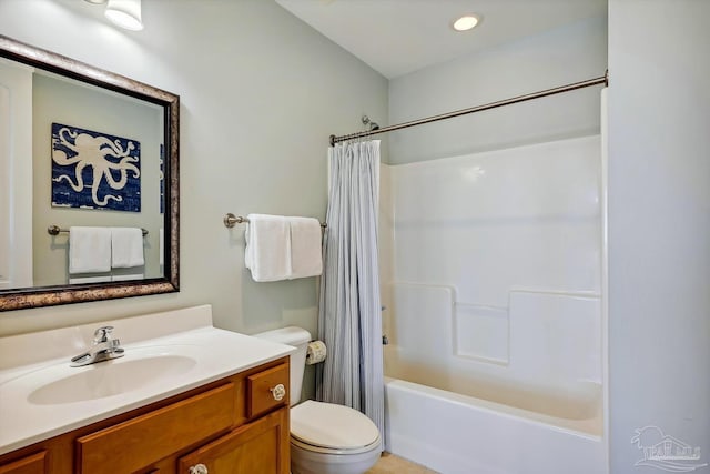 full bathroom with vanity, shower / tub combo with curtain, and toilet