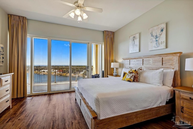 bedroom with dark hardwood / wood-style flooring, a water view, access to exterior, and ceiling fan