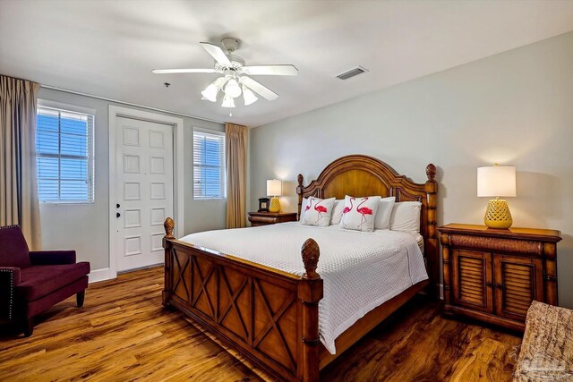 bedroom with hardwood / wood-style floors and ceiling fan