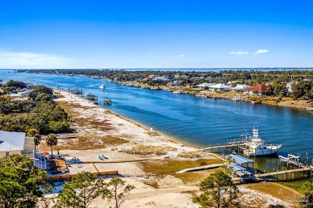 birds eye view of property featuring a view of the beach and a water view