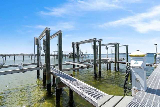 dock area featuring a water view and boat lift