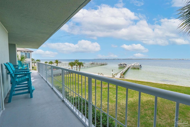 balcony featuring a dock and a water view