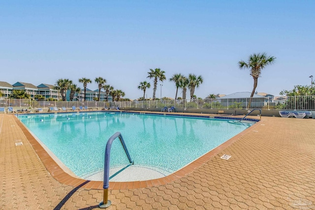 community pool featuring fence