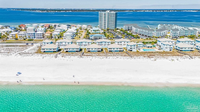 birds eye view of property featuring a residential view, a water view, and a beach view