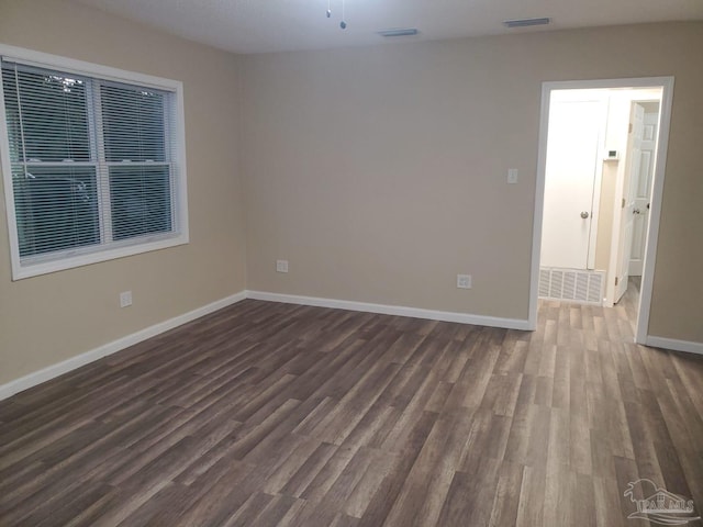 empty room featuring dark hardwood / wood-style floors