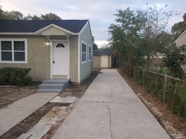 view of front of property with a storage unit