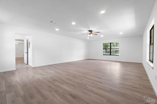 5547 Kauffman Rd, Milton, FL 32583 - unfurnished room with a ceiling fan, recessed lighting, wood finished floors, and baseboards