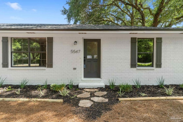 5547 Kauffman Rd, Milton, FL 32583 - view of exterior entry with brick siding