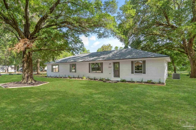 5547 Kauffman Rd, Milton, FL 32583 - ranch-style house with a front yard and central air condition unit