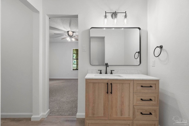 5547 Kauffman Rd, Milton, FL 32583 - bathroom featuring vanity, ceiling fan, baseboards, and wood finished floors