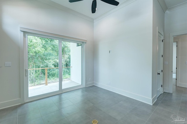 tiled empty room with a wealth of natural light and ceiling fan