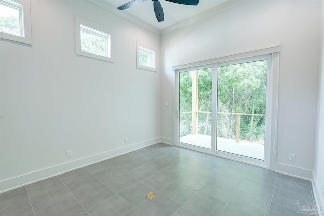 unfurnished room with ceiling fan and ornamental molding