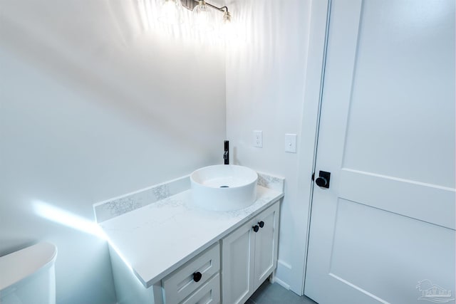 bathroom with toilet and vanity