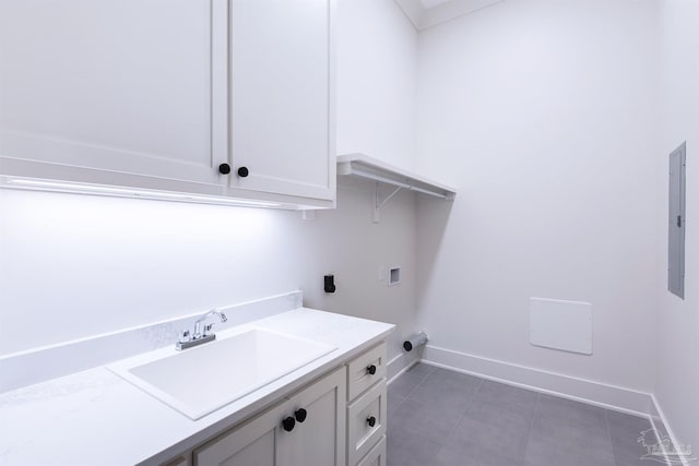 laundry room with dark tile patterned floors, sink, electric dryer hookup, washer hookup, and electric panel