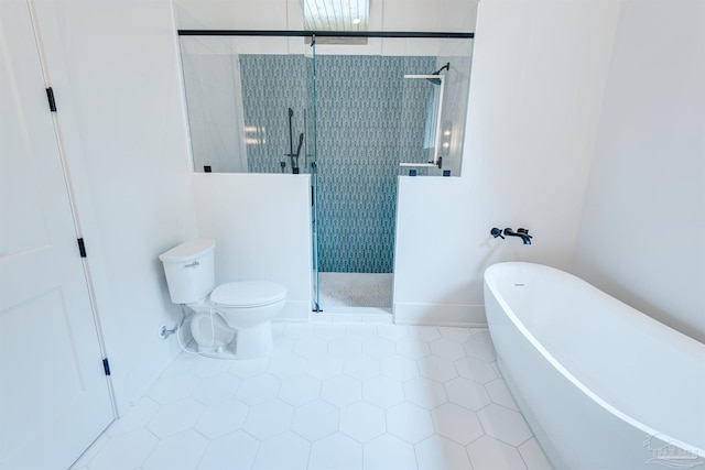 bathroom with tile patterned floors, toilet, and separate shower and tub