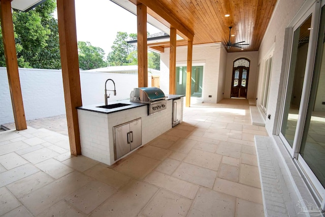 view of patio / terrace with sink, an outdoor kitchen, a grill, and ceiling fan