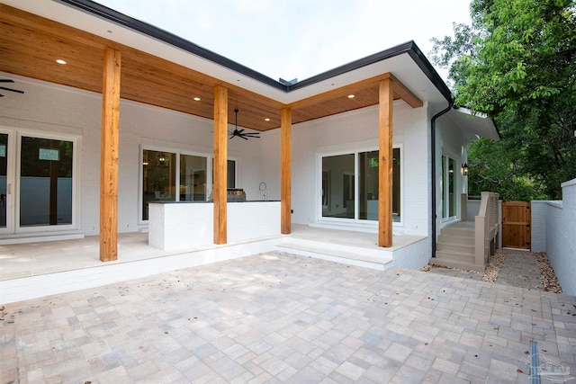 back of house with a patio and ceiling fan