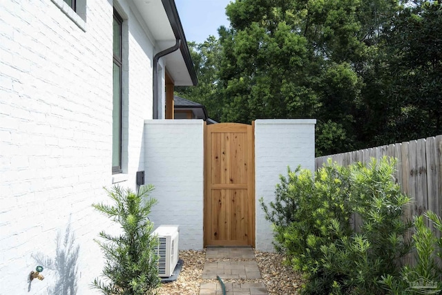 view of gate featuring ac unit