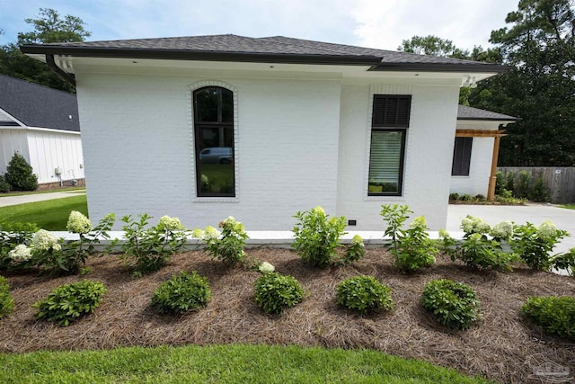 view of side of property with a patio