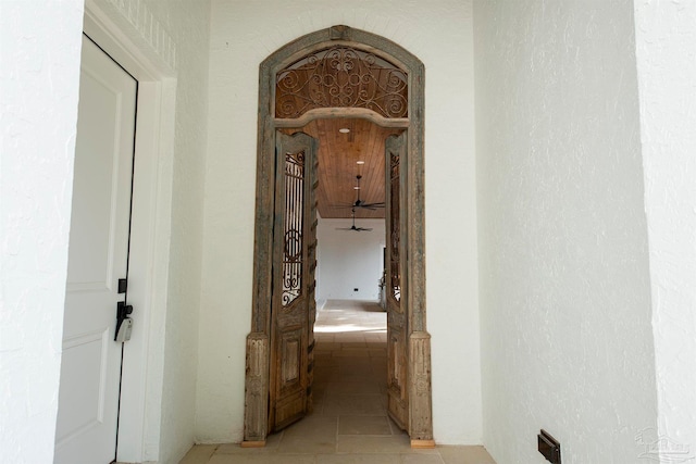 hall with light tile patterned floors