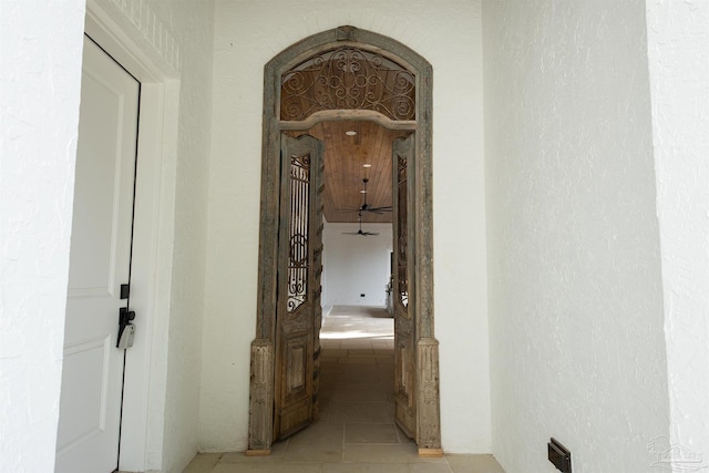 corridor with light tile patterned floors