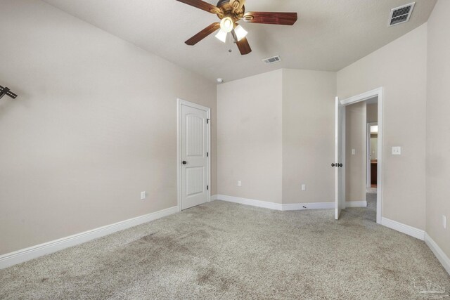 bedroom featuring a textured ceiling, ceiling fan, and light colored carpet