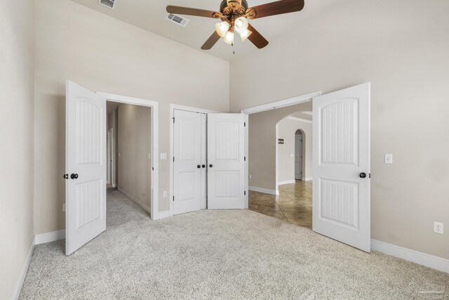 kitchen featuring light stone counters, sink, stainless steel appliances, backsplash, and decorative light fixtures