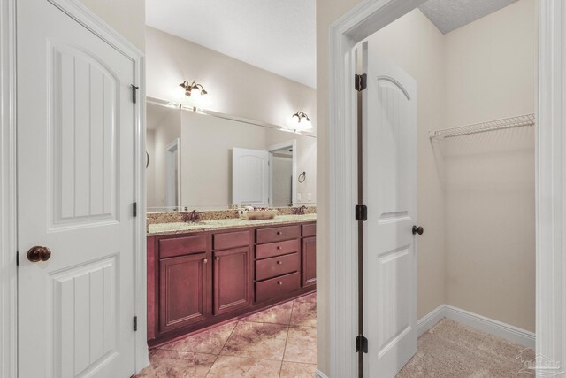 kitchen with a raised ceiling, hanging light fixtures, stainless steel fridge, light carpet, and a breakfast bar area